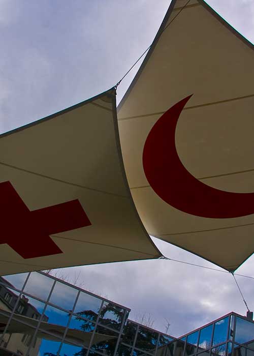 The Red Cross and Red Crescent symbols on two canvases at the ICRC headquarters in Geneva