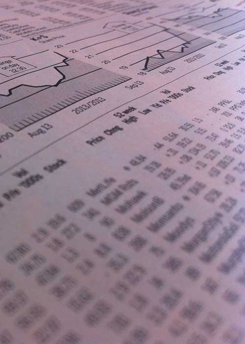 Financial newspaper with charts and figures
