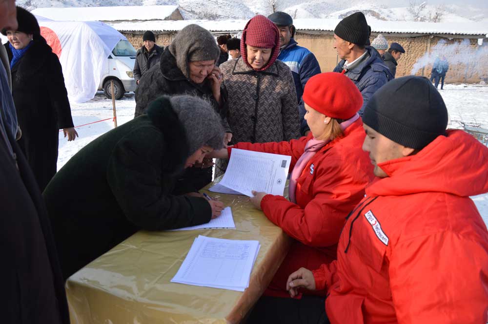 Women registering during natural disaster simulation in Kyrgyzstan